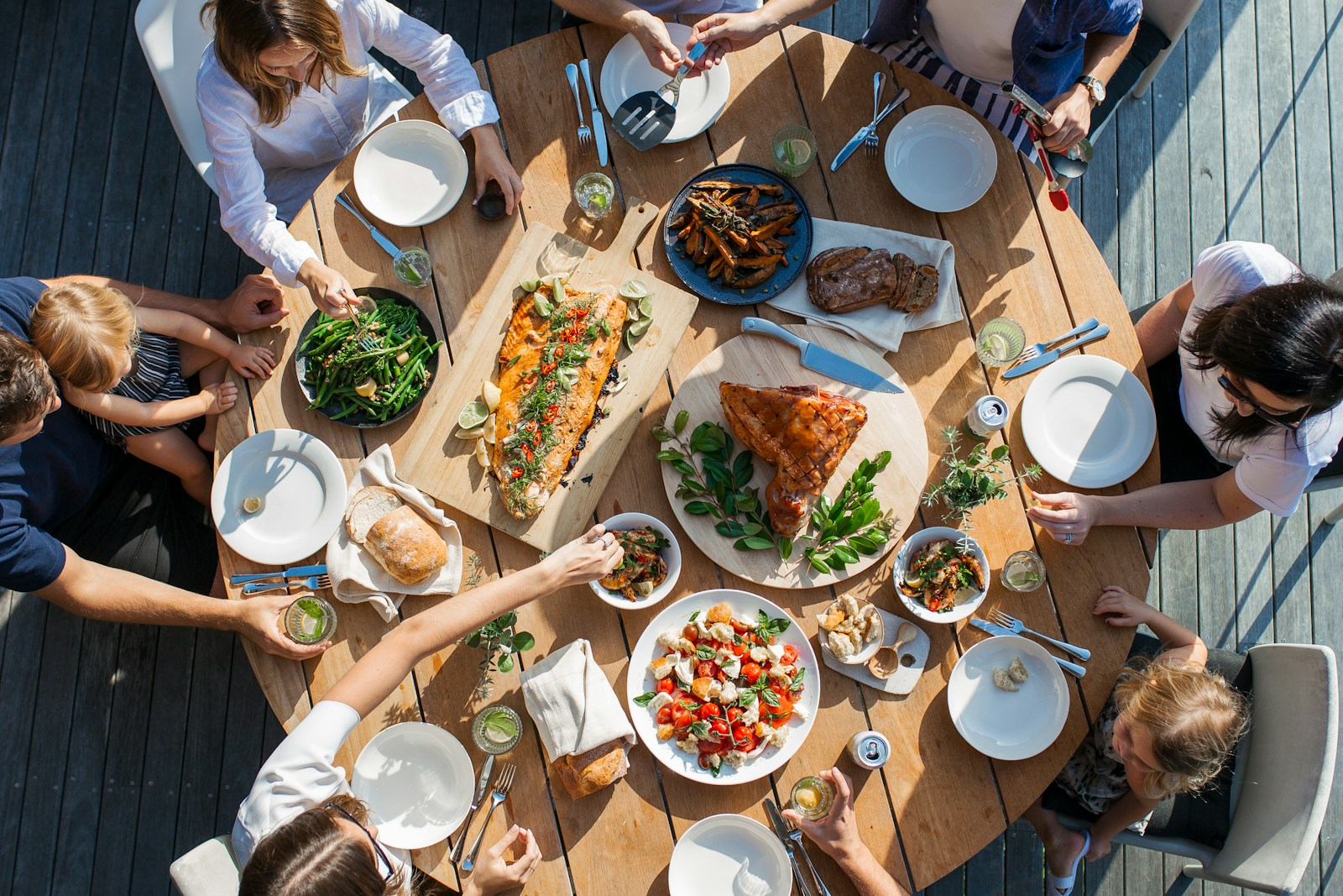 people eating on table with foods and exposure to new food