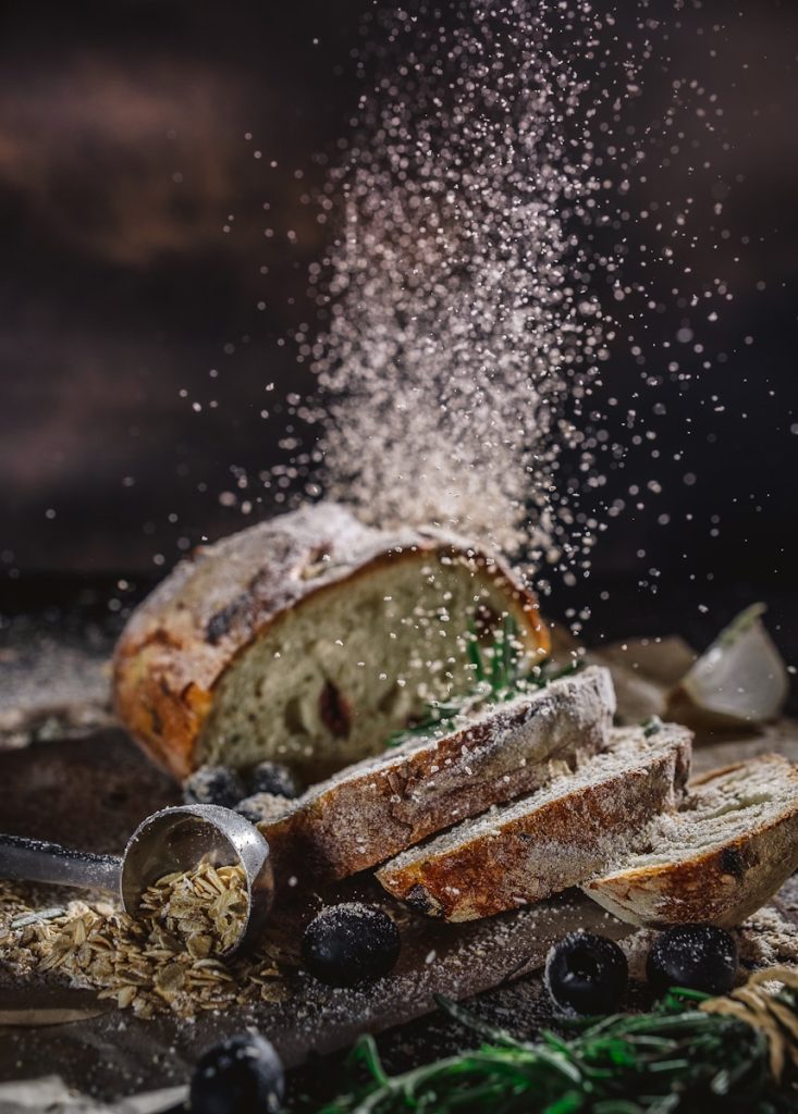 Chef action cooking sliced bread on table