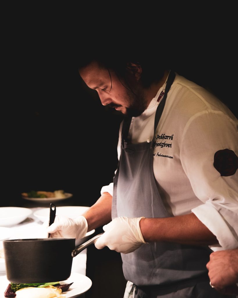 chef cooking at food station