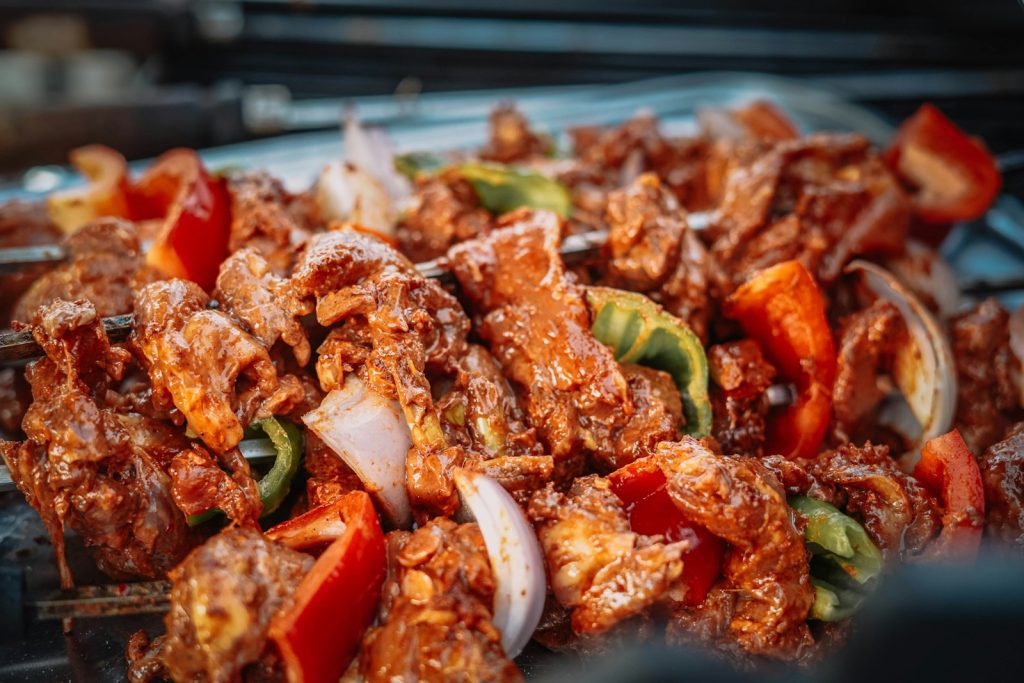 cooked indian food on stainless steel tray